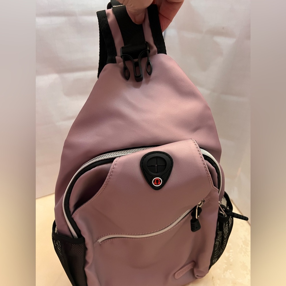 Lavender shoulder sling sporty style bag.